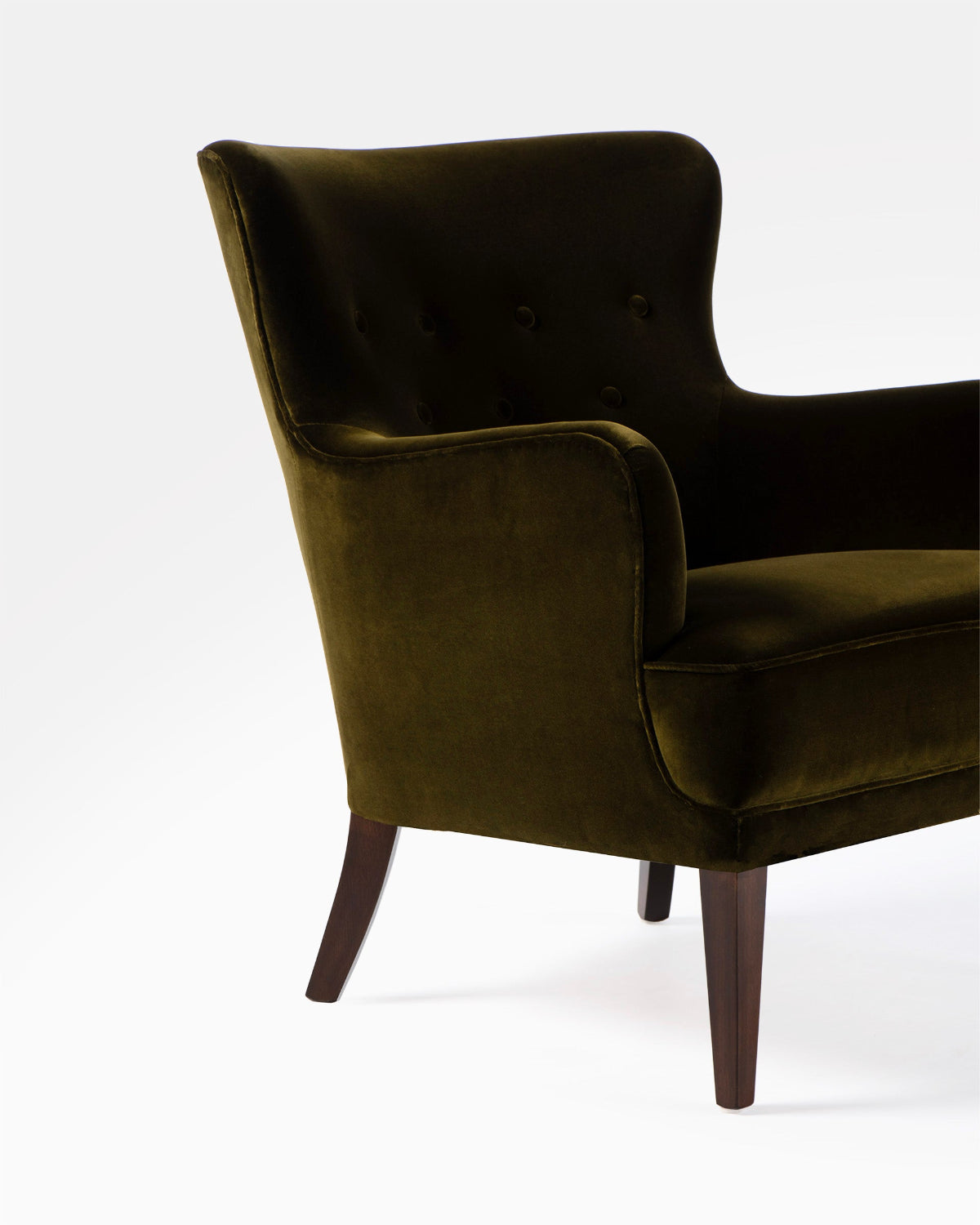 Dark green armchair on a white background