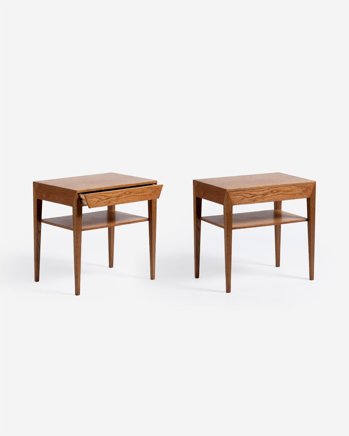 Two wooden side tables on a white background