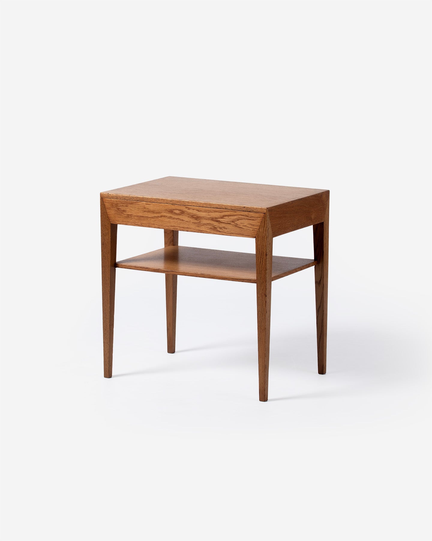 Wooden side table with a shelf on a white background