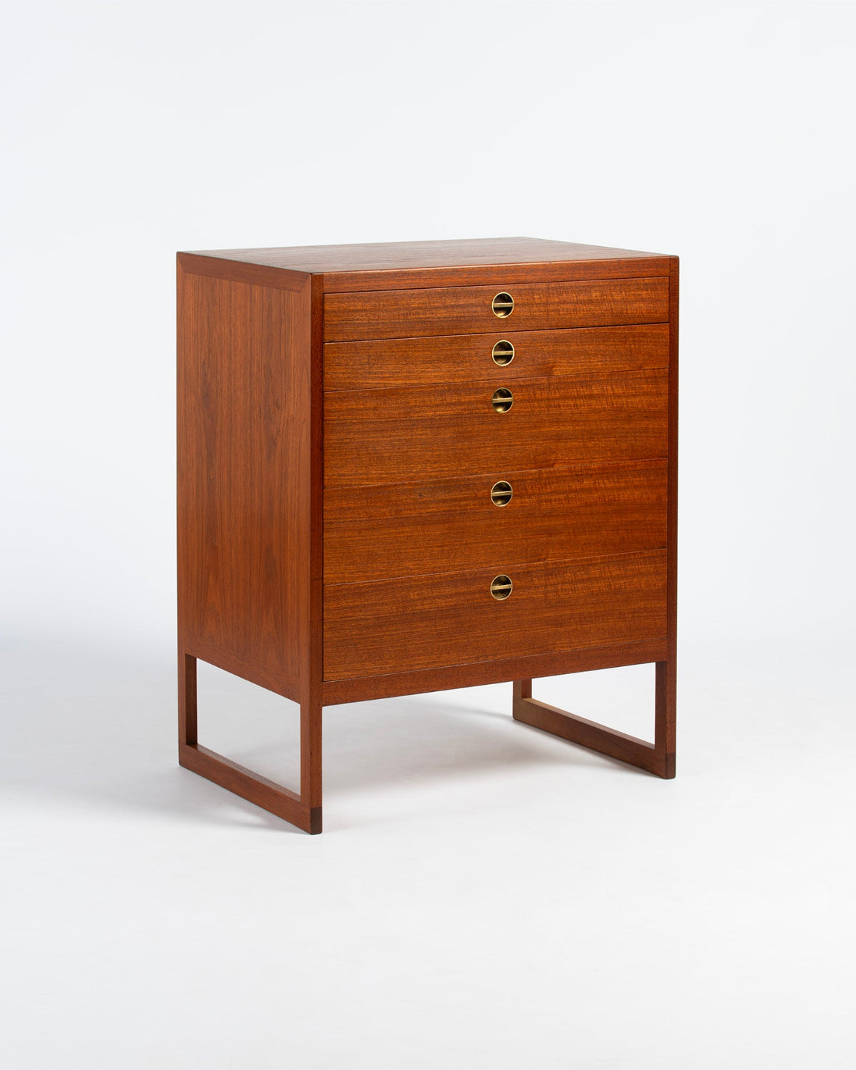 Wooden dresser with multiple drawers on a white background